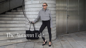 Model in Pepita Waterproof Anorak and Black Sense Stirrup Tights styled with sunglasses and Black Waterproof Apparel Tote Bag