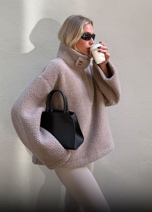 Model wearing Pile Anorak and Moment Puffer Jacket from Warming Collection
